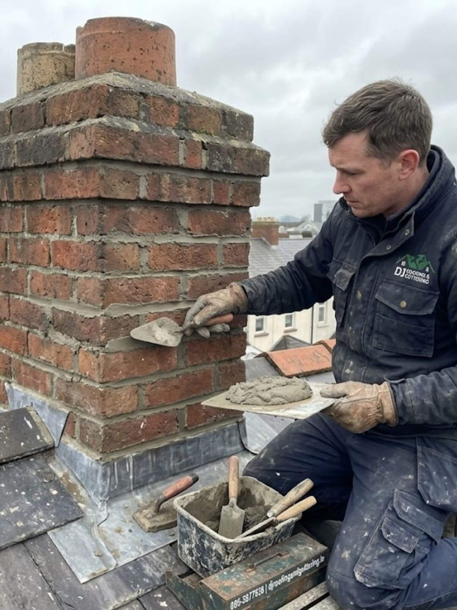 Roofer repairing a chimney